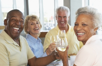 Two couples enjoying a happy toast